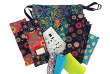 Load image into Gallery viewer, The Days for Girls Supreme Kit is made up of two shields, eight liners, two panties (available in small, medium or large), a wash cloth, a soap, a waterproof pouch and a drawstring bag.
